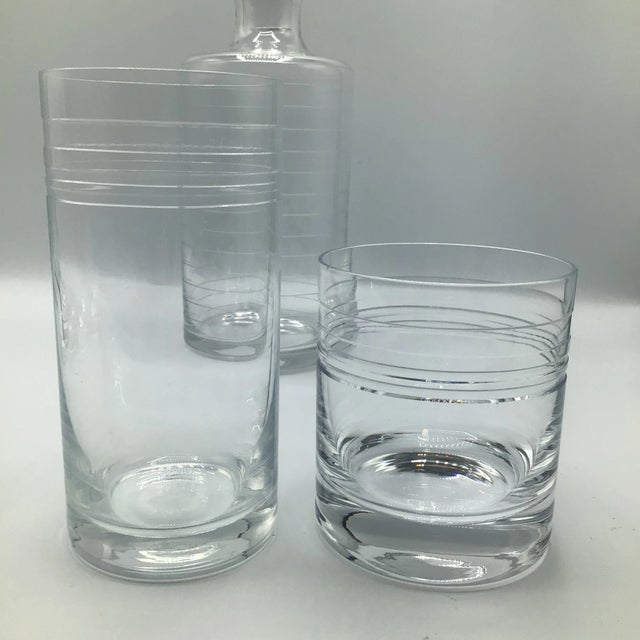 From my research I believe this set was made in Denmark the glasses have 4 etched lines around the top. The highball glass...