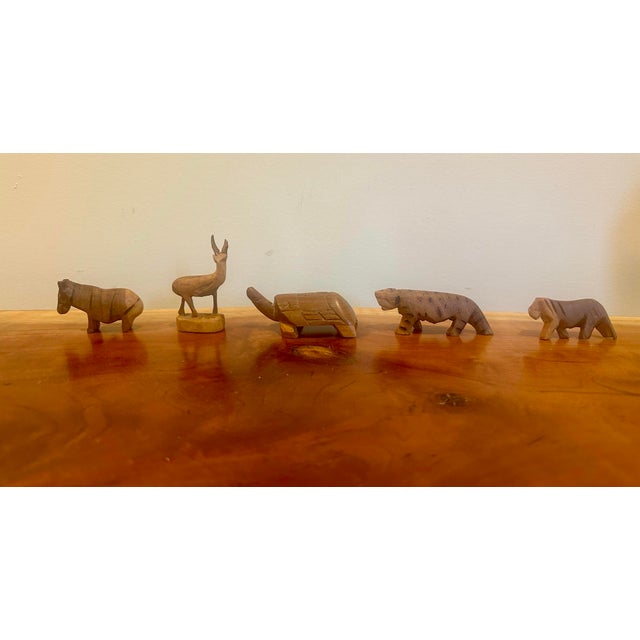 Bring warmth and character to a shelf, tabletop, or curated vignette with this delightful collection of nine hand-carved...