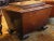 George IV period cellarette of mahogany with carved laurel wreath. Well molded and shaped top and feet. Bramah lock. Ideal...