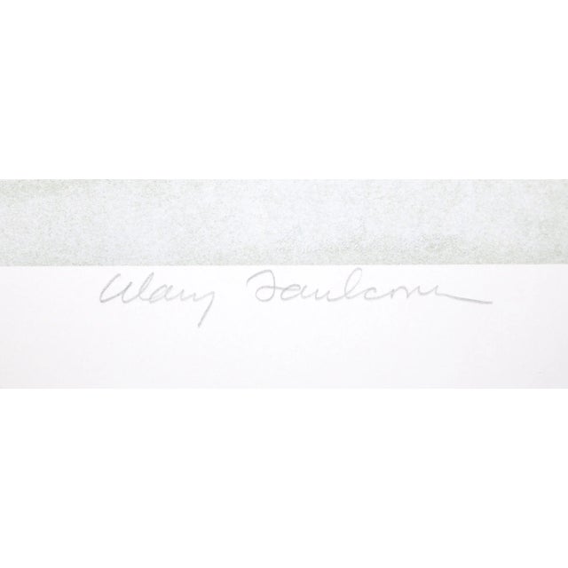 Set against a textured, off-white background, the white bottle of Grey-Poupon dijon mustard holds a flourishing bundle of...