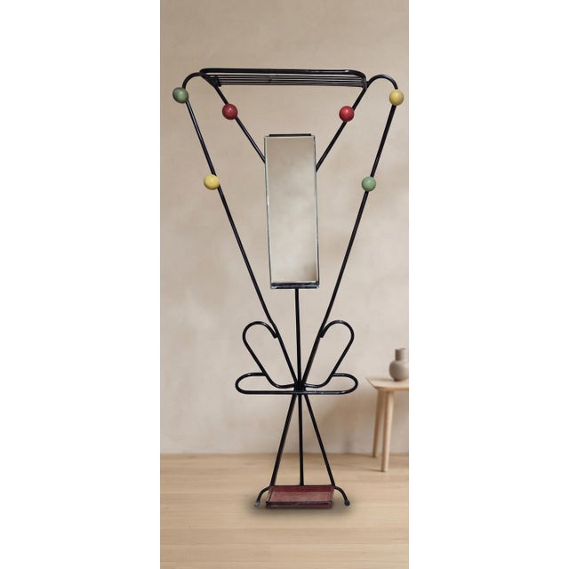 A distinctive vintage coat rack attributed to French designer Roger Feraud, dating from the early 1970s. The sculptural...