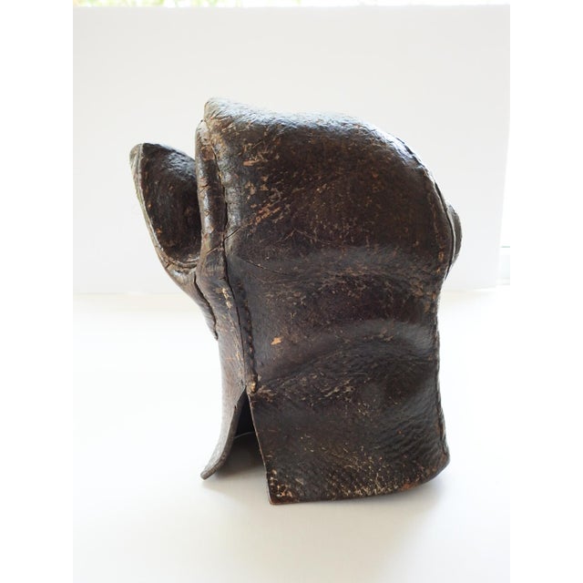 Early 20th century thick leather glove or mitten, all hand sewn, it is quite hard and easily stands on its own. Great...