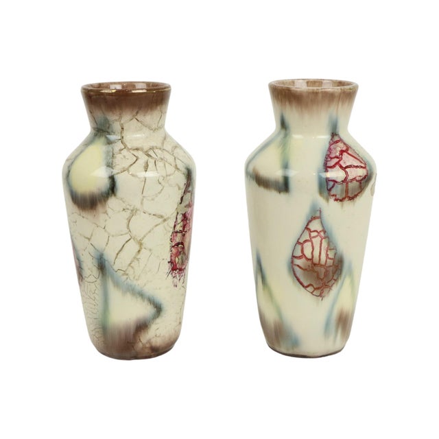 Pair of West German pottery vases featuring abstract shapes and patterns—one with a marble effect—by Bay Keramik...