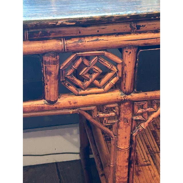 Striking antique 19th century Chinese Chinoiserie bamboo rattan and black lacquer tortoise finish desk having geometric...