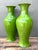 This striking pair of baluster-form ceramic vases showcases a masterful application of vibrant lime green glaze with a...