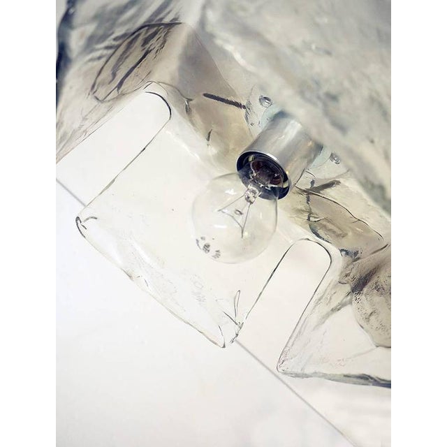 Elegant flush mount and wall sconce executed in hand blown partially amber and clear murano glass and chromed hardware...