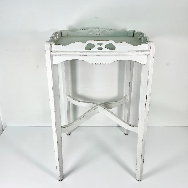A delightful Shabby Chic Farmhouse Side Table that features a wood Gallery around the tabletop. These three table has...