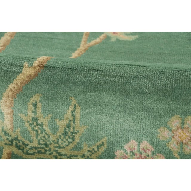 Hand-knotted in wool, this 3x10 contemporary runner celebrates the poetic beauty of Chinese Deco design. Set against a...
