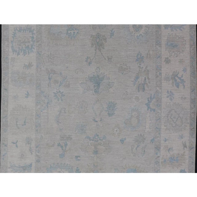 Modern Tribal Oushak with Light Silver-Gray Colored Background and Cream Border. Country of Origin: Afghanistan; Type:...