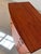 This Danish teak chest of drawers is an exceptional collector's item, instantly recognizable by its rare, semi-circular...