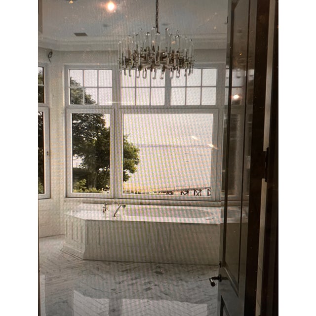 As described on the Visual Comfort website: "The Bonnington by AERIN features elongated crystals that provide both sparkle...