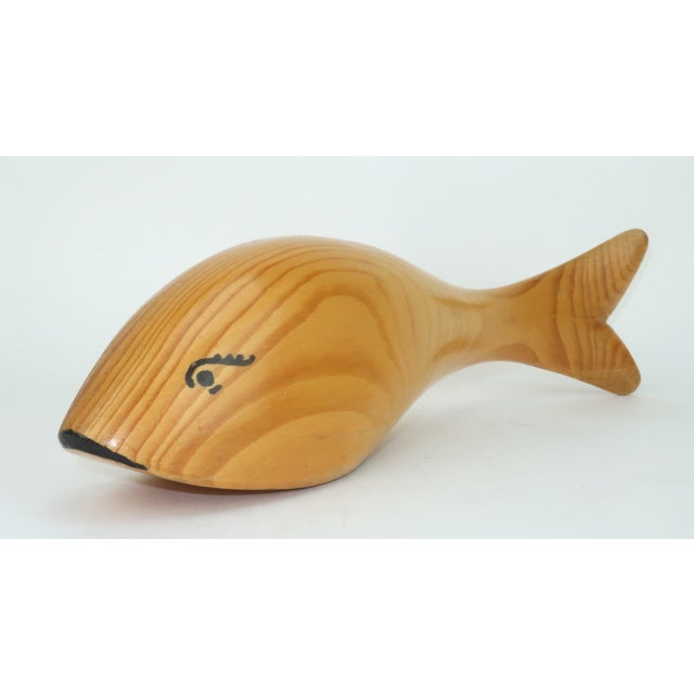 'Drink like a fish' with this handy dandy C.1970 wood fish shaped bottle opener in an extra large size. The wood appears...