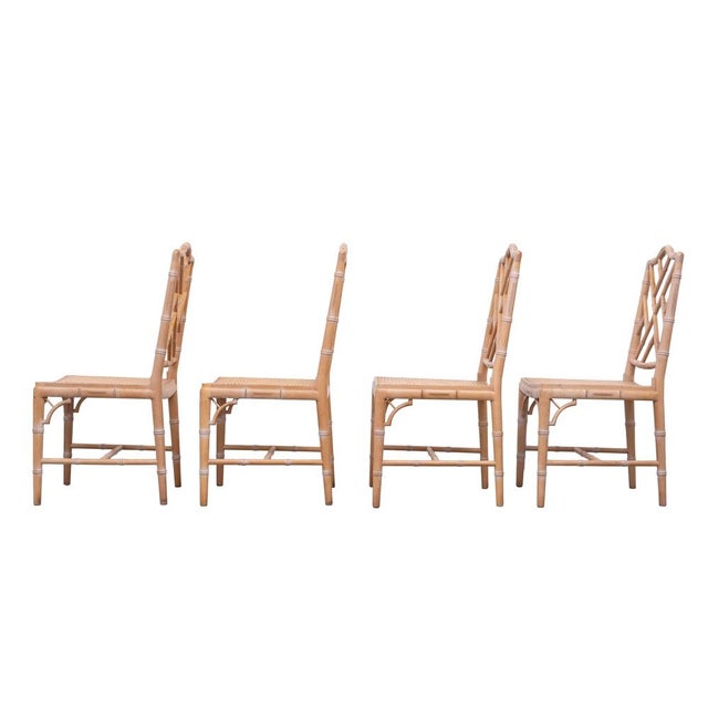 Fabulous set of 4 vintage Chinese Chippendale chairs. Features solid wood frames and chic, woven cane seats and a pretty...