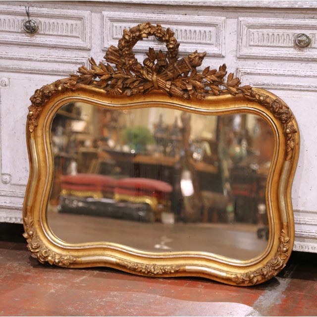 Decorate your wall with this elegant antique giltwood mirror crafted in France circa 1860. Of unusual and eye-catching...