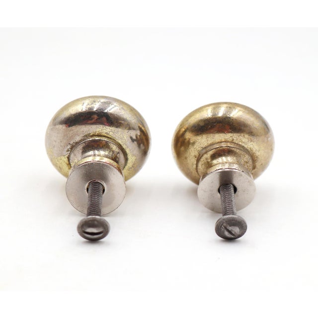 Classic style drawer or cabinet knobs made of brass with a polished brass finish. Mounting screws are included. Good...