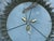 A Spanish gilt metal semi-flush crown chandelier from the Midcentury period, with three-tiered foliage décor and Edison...