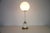 This elegant italian table lamp from the 1960s beautifully reflects the refined modernism of mid-century design. The piece...
