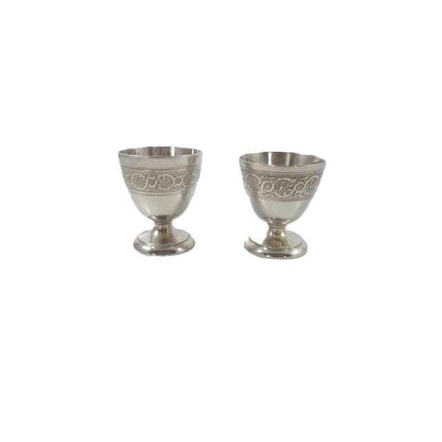 A pair of silver-plated egg cups by Christofle, bearing early factory marks that pre-date 1935. Each cup is stamped with...