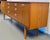 A striking example of 1960s–70s British mid-century craftsmanship, this Schreiber teak sideboard brings refined...