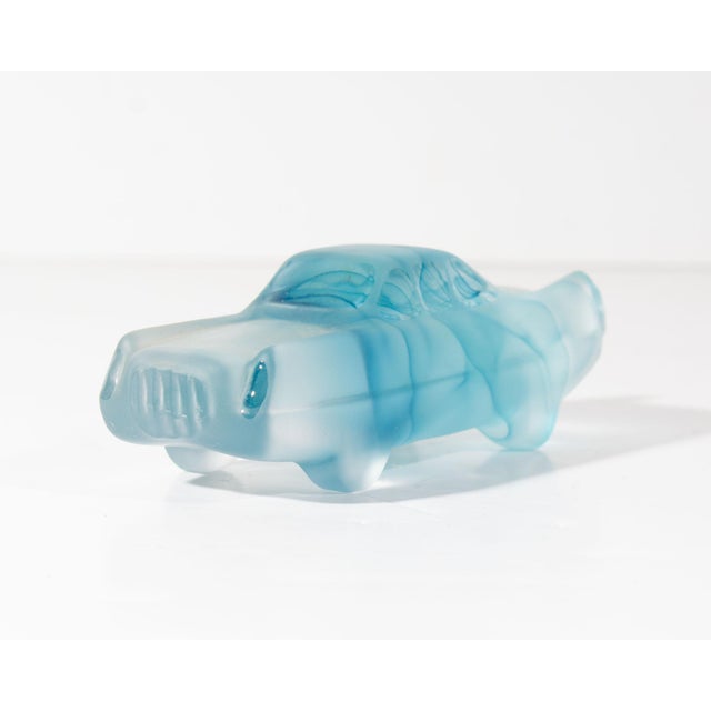 A "Car-Toons" glass car designed by the Swedish glass artist Olle Brozén (born 1963) for Kosta Boda. Made in Sweden, this...