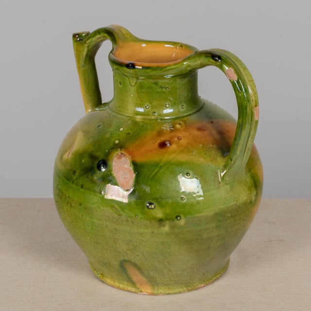 A 19th century French Provincial green glazed terracotta water jug, know as an orjol or cruche. Beautiful variegated color...