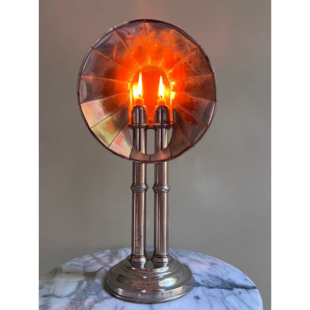 A handsome silver-plated reflector candle lamp, english, late 19th to early 20th century. the stepped circular base...