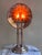 A handsome silver-plated reflector candle lamp, english, late 19th to early 20th century. the stepped circular base...