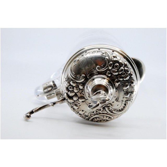 Acid Etched Glass Wine Jug with Silver Relief Lid, in Very Good conditions. Designed 1890 to 1919 This piece has an...