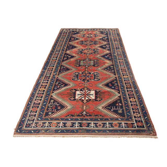 Antique decorative wool handknotted Caucasian rug. Approximately 75-85 years old. In very good condition.