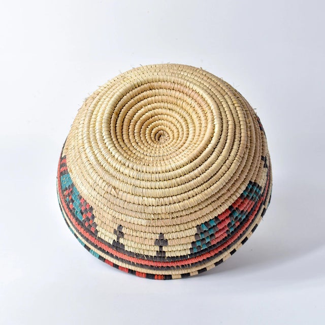 This vintage handmade basket bowl, crafted by the Hausa people of Northern Nigeria, are exquisite examples of traditional...