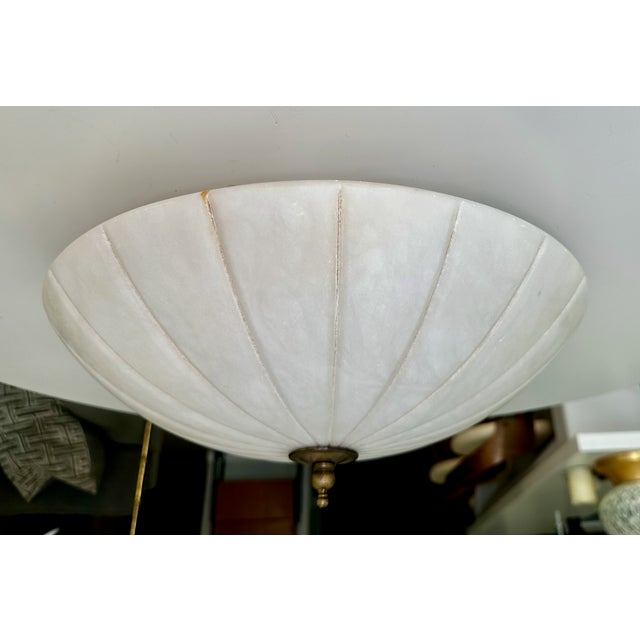 Directoire-style flush mount ceiling fixture, expertly crafted from a single solid piece of natural white alabaster stone....