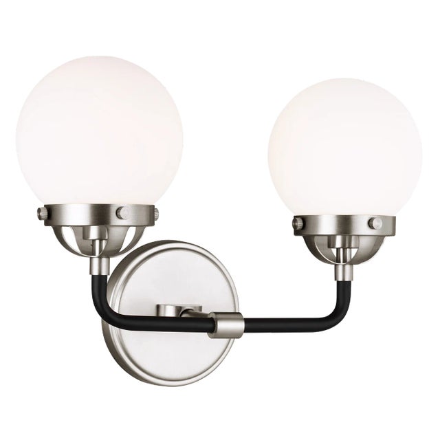 The Cafe two light vanity fixture in brushed nickel provides abundant light for your bath vanity, while adding a layer of...