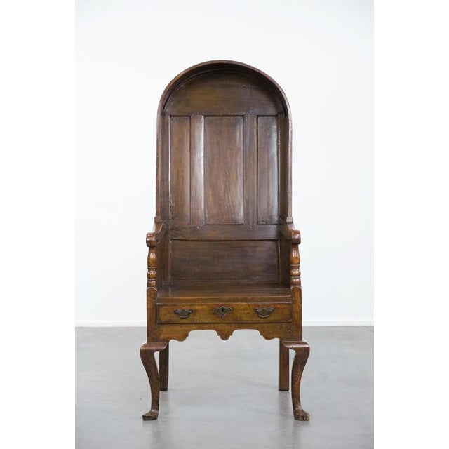 We are offering this wonderful and unique antique English hooded lambing chair from the 18th century with a hood shape and...