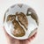 Fantastic set of two large vintage porcelain mini carpet balls. Brown and white chinoiserie. Love the fruit and bird...
