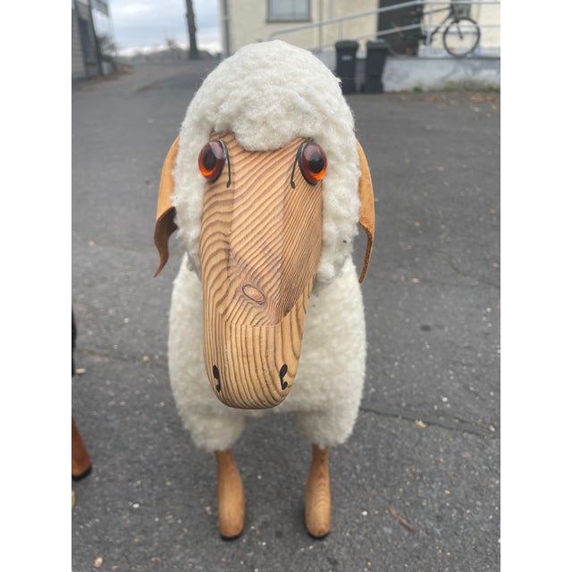 Charming decorative wool sheep by Hanns Peter Krafft. Germany, 1970s. Handcrafted from solid beechwood, leather, and...