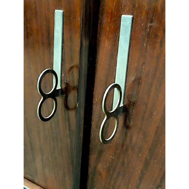 The “Pellicano” sideboard, designed by Vittorio Introini for Saporiti around 1960, is a refined example of mid-20th-...