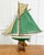 This pond yacht, made in England in the twentieth century, is carved in wood and rigged as a gaff cutter, retaining its...