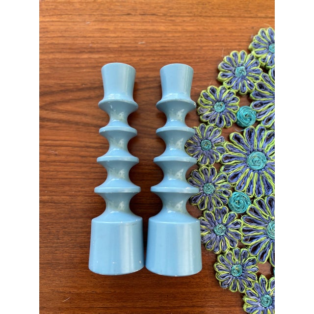 This pair of Mid 20th Century Danish modern candlesticks is a stunning example of Danish craftsmanship from the 1950s. The...