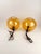 A gorgeous pair of vintage Mid Century Modern Style Pendant Lights in Amber Smoked Glass. When lit they cast the most...