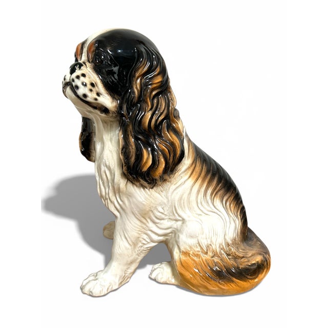 Beautifully hand painted ceramic spaniel figurine- stands at 16” tall, and would make the perfect “companion” to any home.