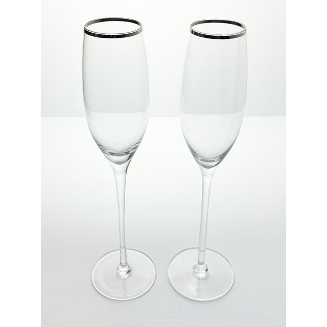 Pair of Contemporary Tall Fluted Silver Rim Champagne Glasses 11” 8oz Good condition. No chips, cracks, or fleabites....