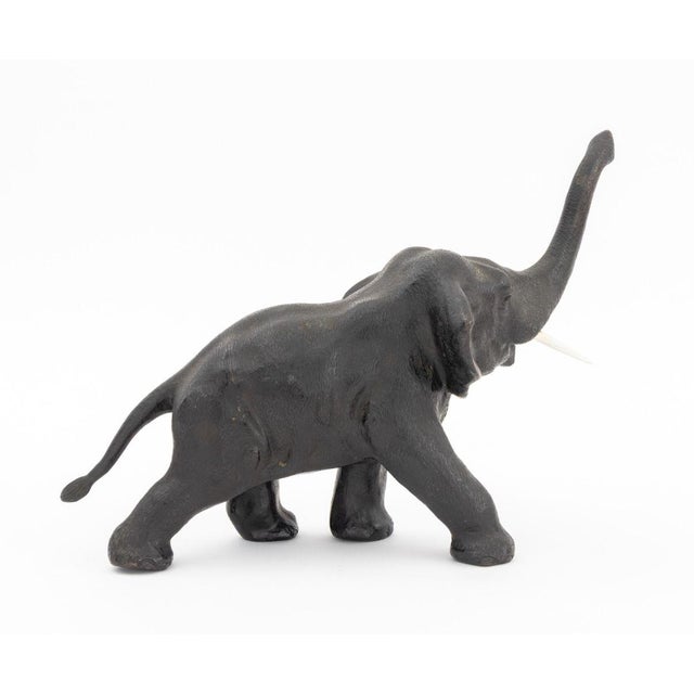 Elephant Patinated Bronze Sculpture. 8" H x 12" W x 4.5" D. Provenance: From a New York City Collection.