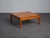 A square “hongisto” coffee table designed by ilmari tapiovaara and produced by laukaan puu in finland during the 1960s....
