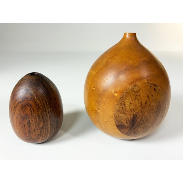 Offered are a pair of turned wood weed pots. The larger of the two is signed, "JDR". It has been turned from five distinct...