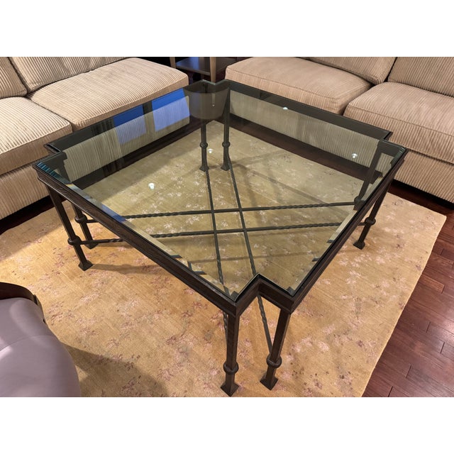 Custom Glass & Iron Coffee Table. Excellent condition. Solid base. Bevel edge glass top. See photo for details in metalwork.