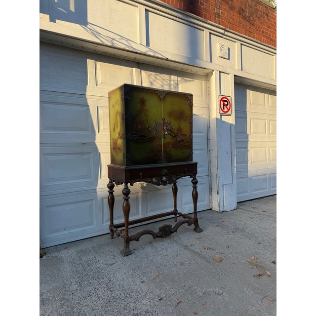 We have an absolutely gorgeous vintage chinoiserie cabinet for sale. This stunning Asian inspired cabinet features a rich...