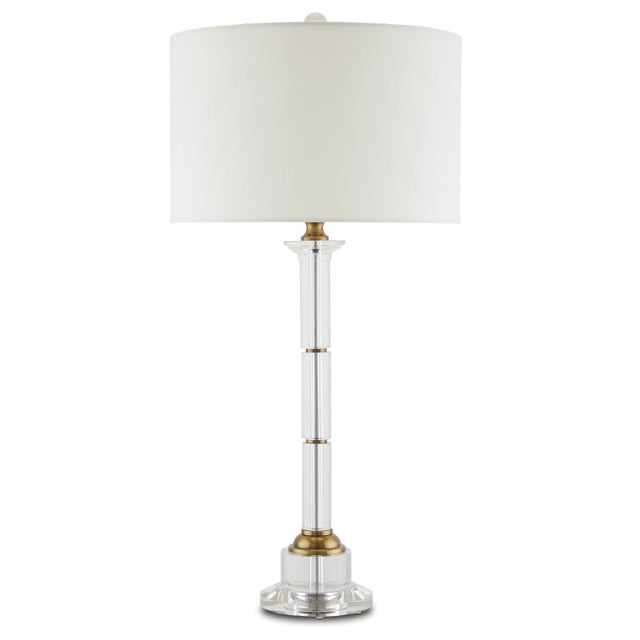 The Lothian Table Lamp is a classically shaped design made of clear optic crystal and metal in an antique brass finish....