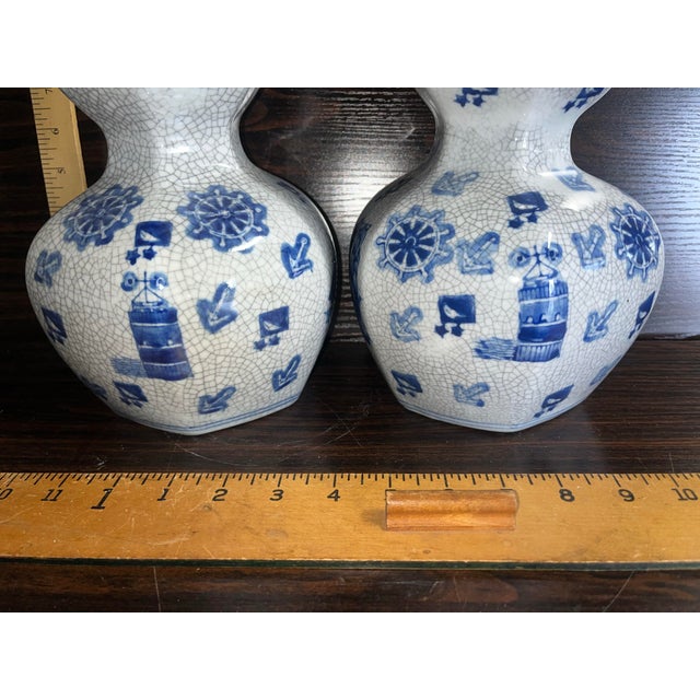 A pair of beautifully aged porcelain crackle ware cases in gourd form. Imported by Seymour Mann post 1948.