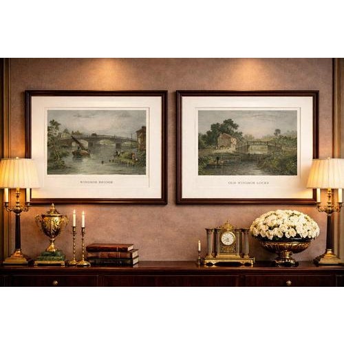 A refined and highly decorative pair of antique hand-colored engravings depicting picturesque views of Windsor and its...