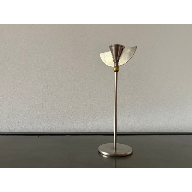 These sculptural angel wing candlesticks are attributed to Italian designers. Diameter of the candlestick base approx. 8.5...